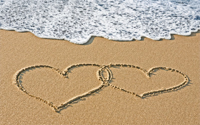 2 hearts in the sand on the beach